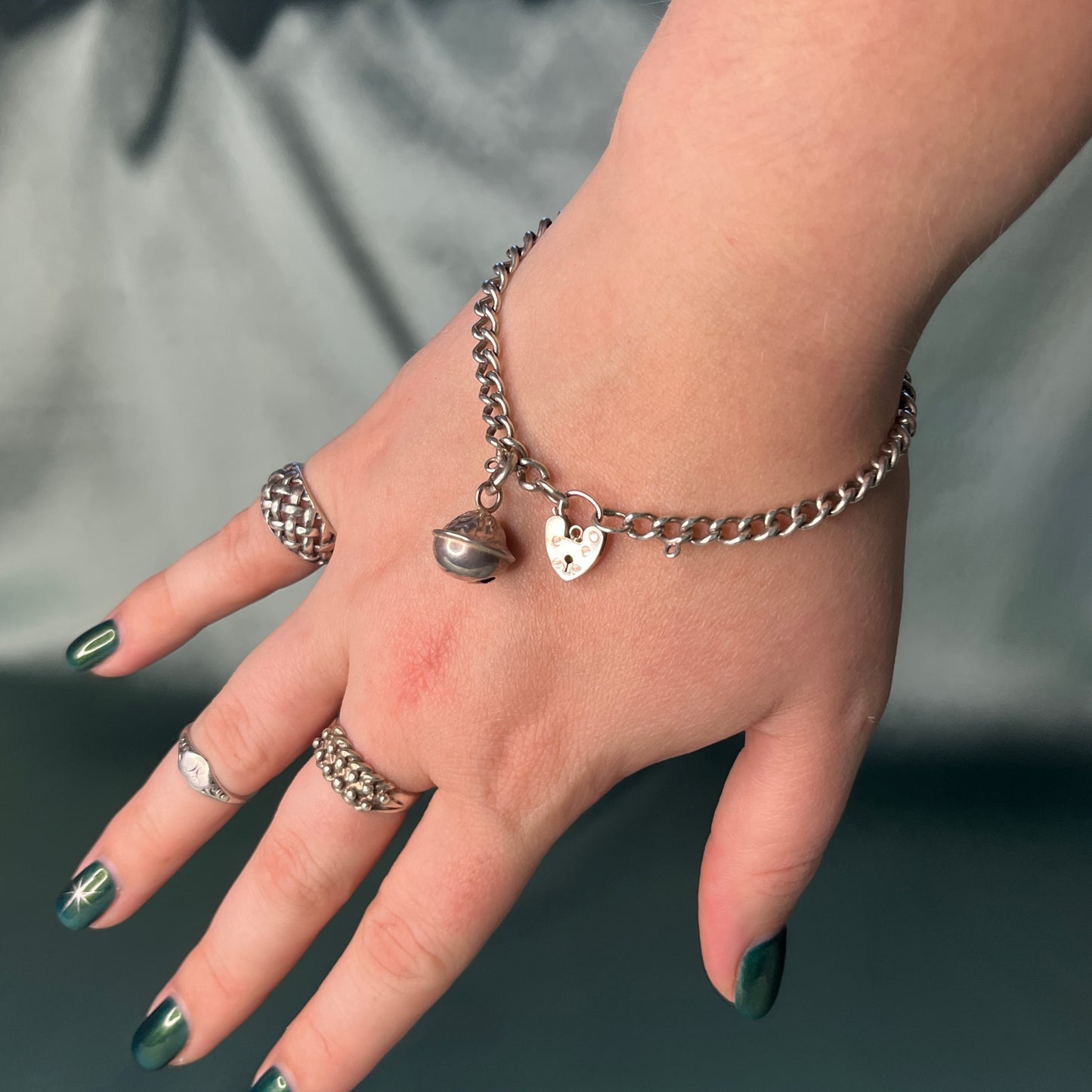 Silver Curb Chain Bracelet with Heart Padlock and Bell Charm