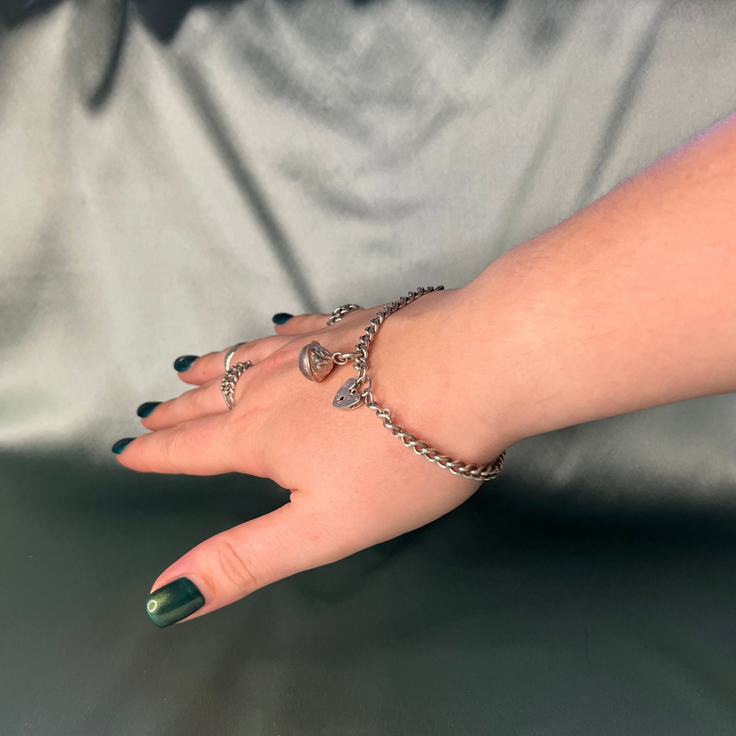 Silver Curb Chain Bracelet with Heart Padlock and Bell Charm