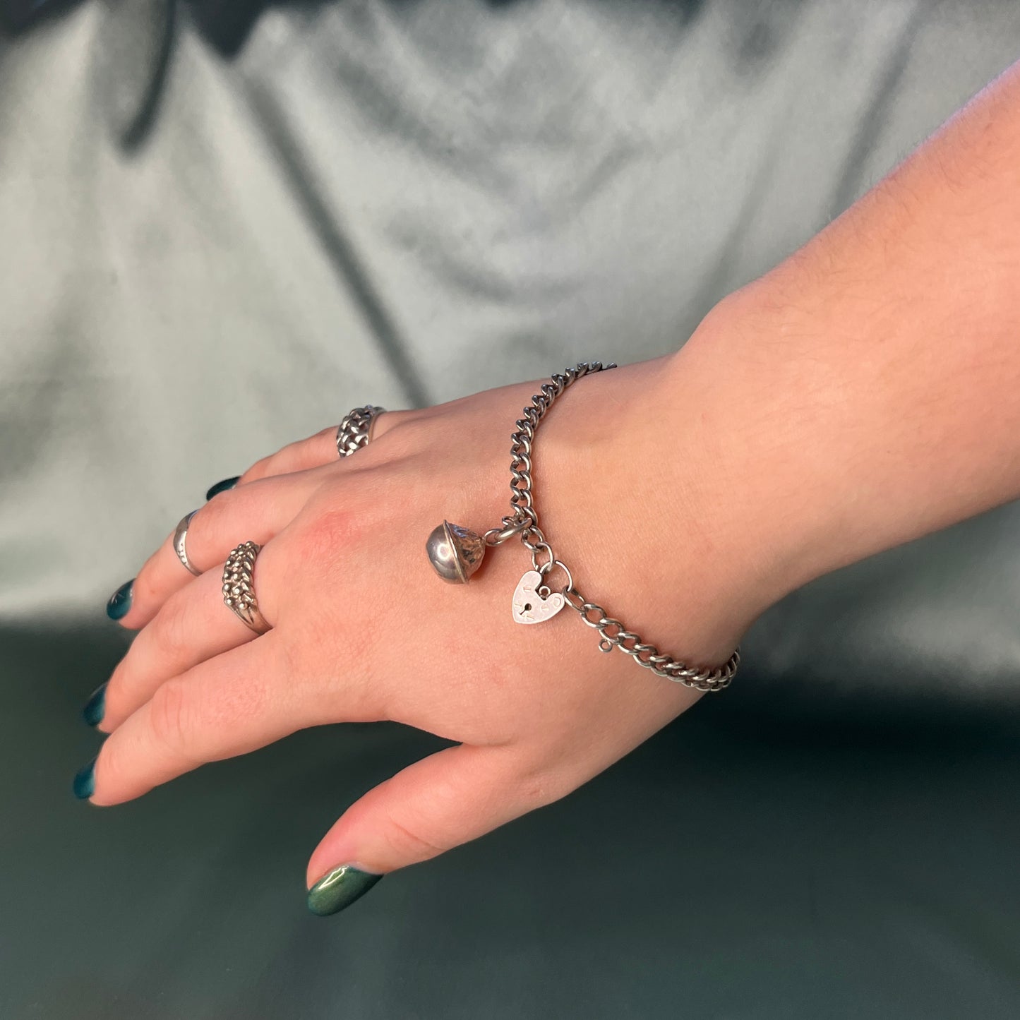 Silver Curb Chain Bracelet with Heart Padlock and Bell Charm