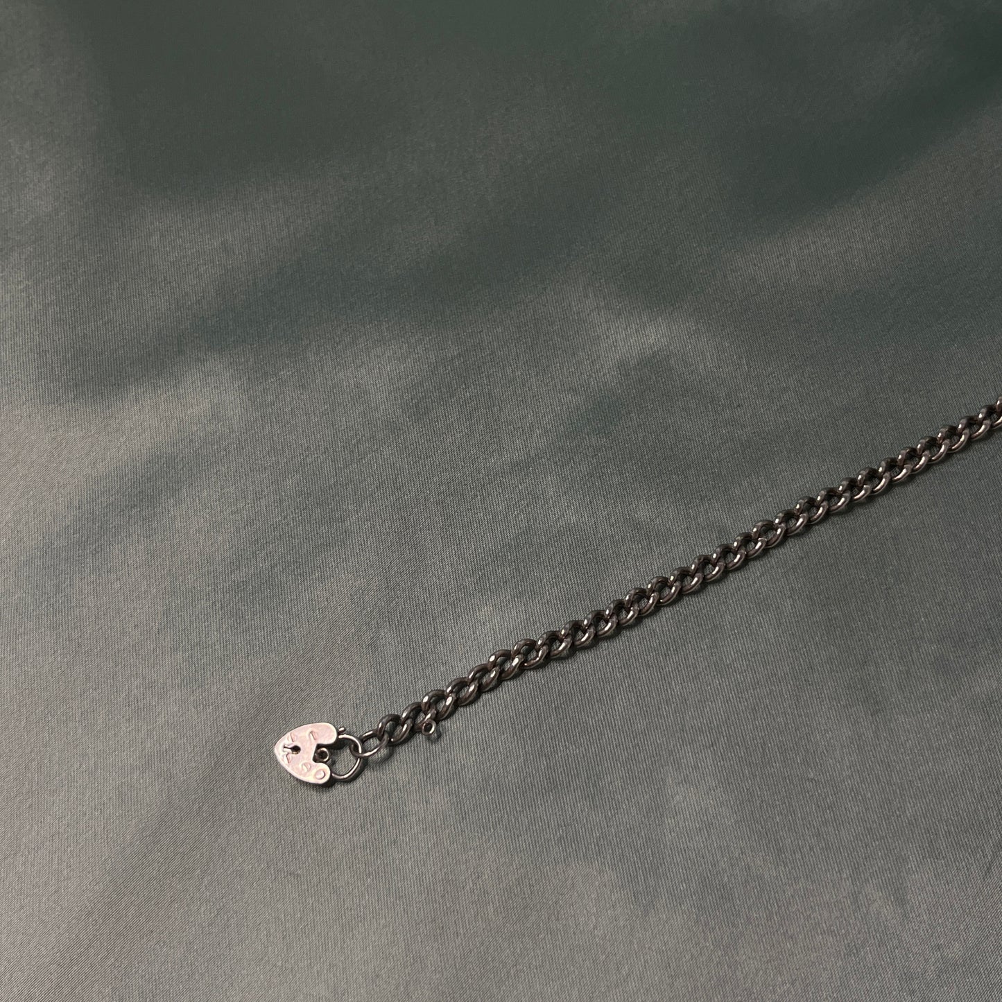 Silver Curb Chain Bracelet with Heart Padlock and Bell Charm